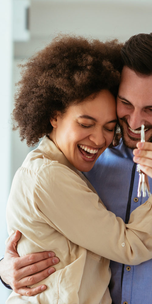 https://www.resourcefinancialservices.com/wp-content/uploads/2019/01/Happy-Young-couple-holding-keys-copy-500x1000.jpg